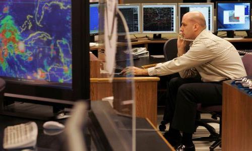 A meteorologist tracks a hurricane.